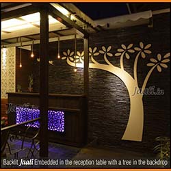 Backlit Jaali Embedded in the reception table with a tree in the backdrop copy